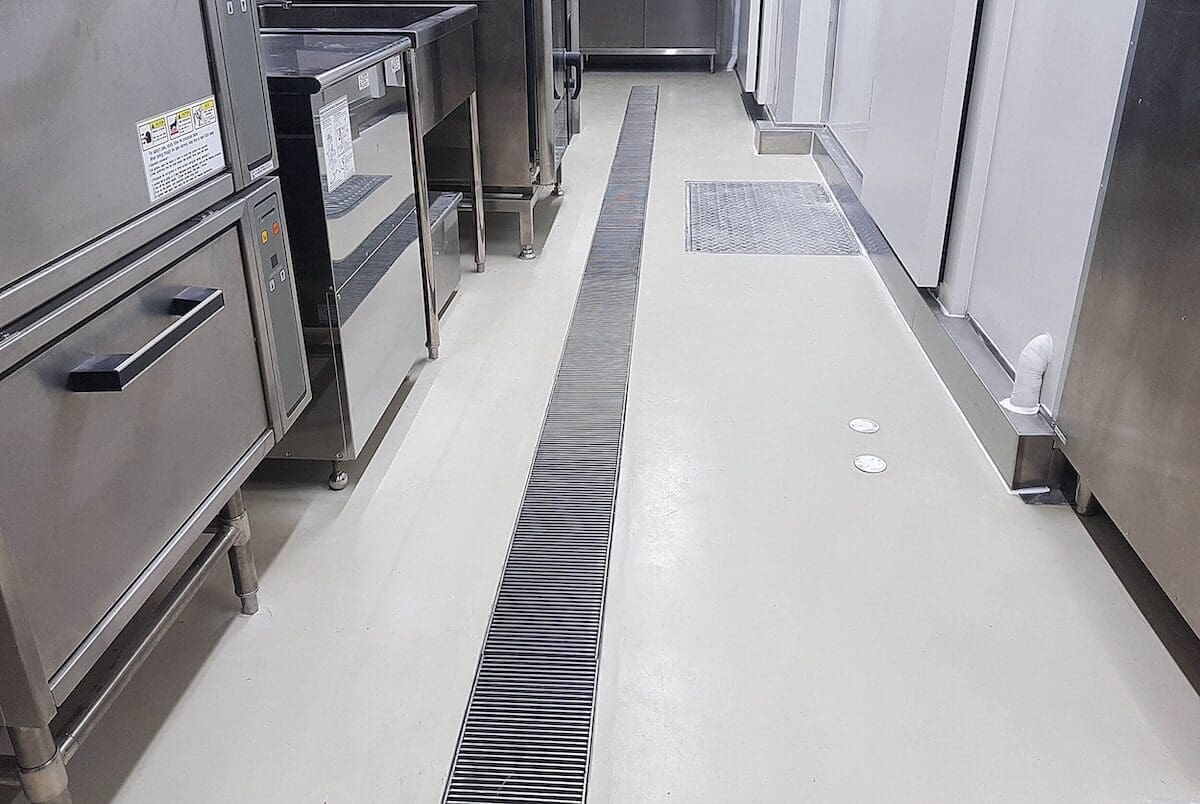 Epoxy flooring with a drain