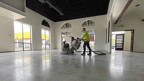 Team member in concrete polishing process